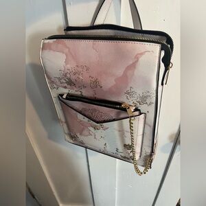 Pink Arden’s leather bag